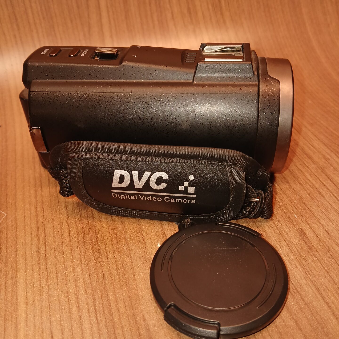 HDV-514K Plus camcorder side profile with DVC strap and lens cap