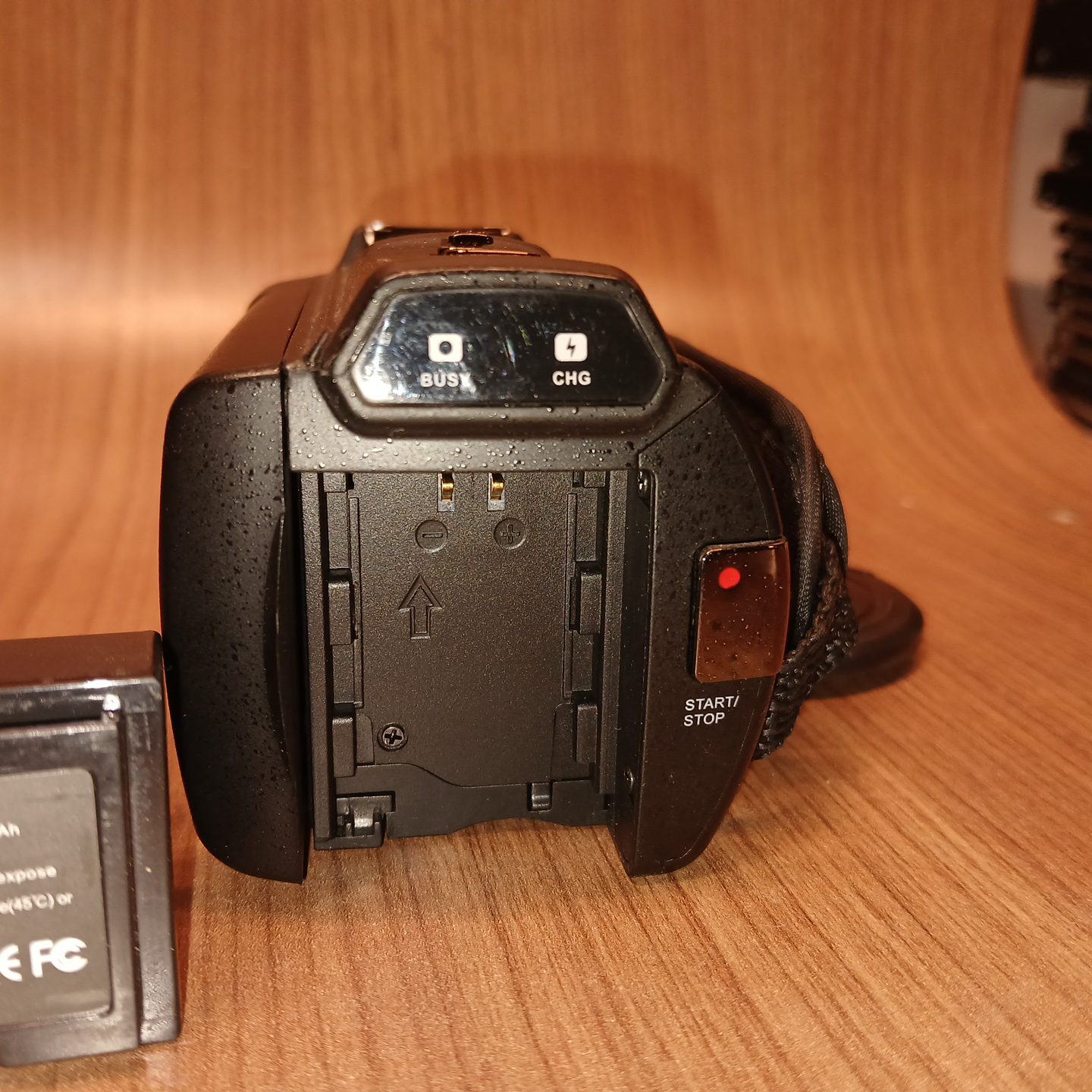HDV-514K Plus digital camcorder rear view with start stop button and charging indicator