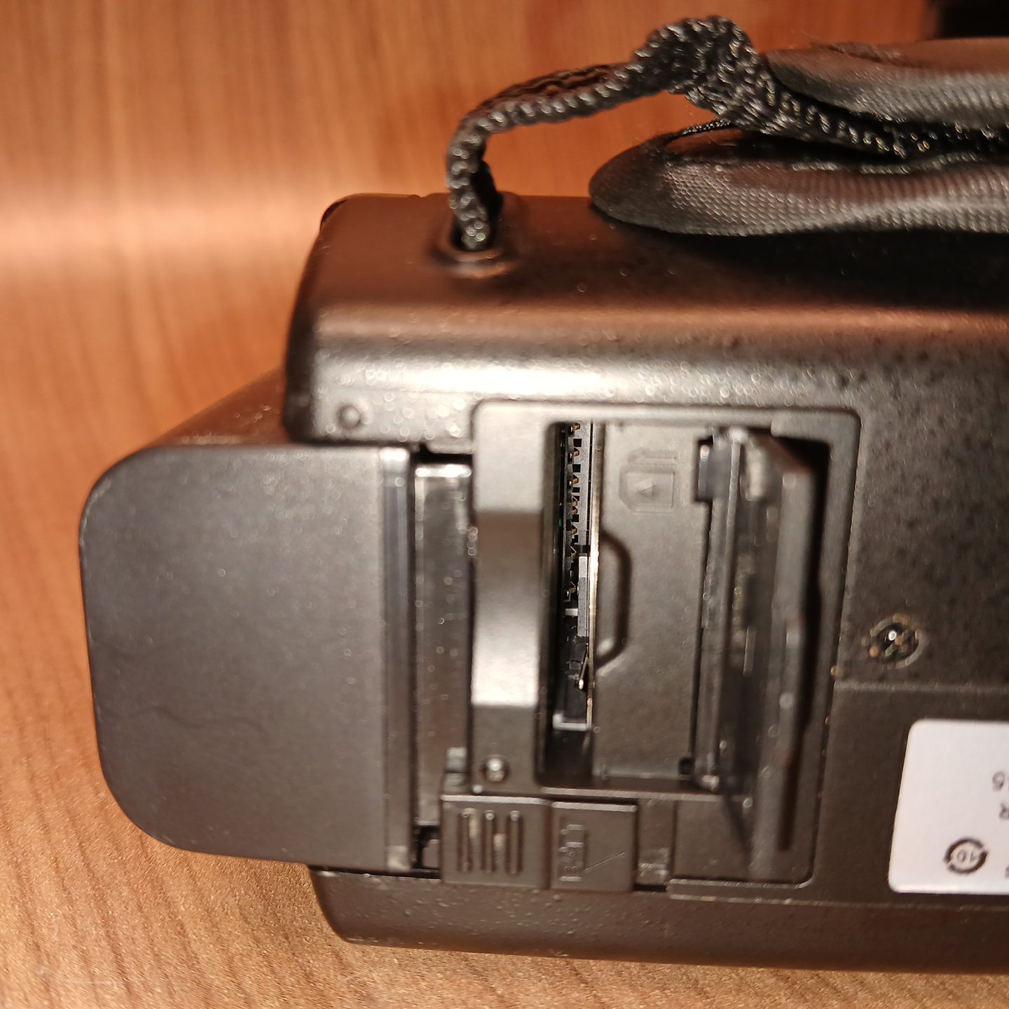 HDV-514K Plus camcorder memory card slot and battery bay detail