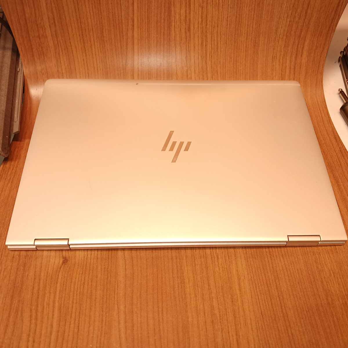 Closed HP EliteBook x360 1030 G2 laptop showing silver lid with HP logo