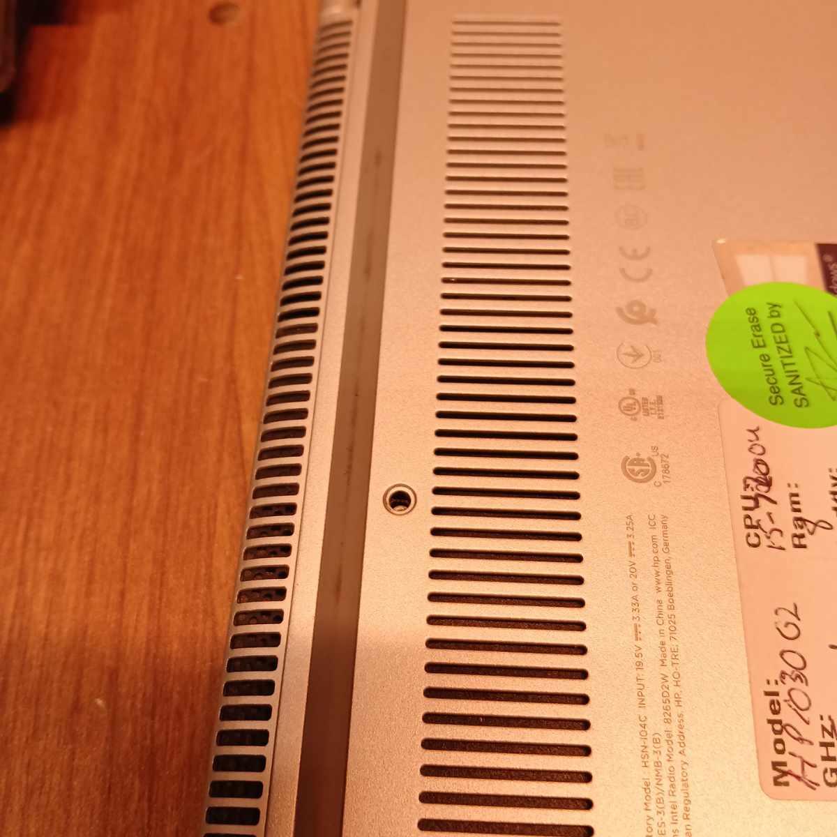 HP EliteBook x360 1030 G2 underside ventilation grille with exposed screw hole missing screw