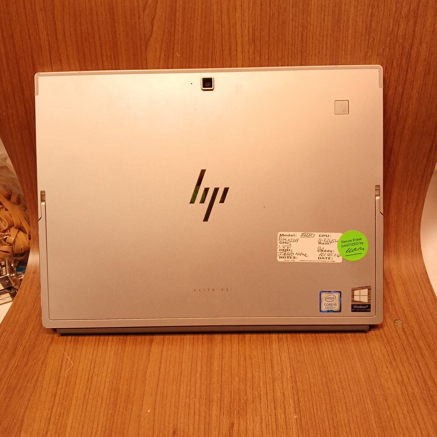 Rear view of HP Elite x2 G4 tablet back cover with HP logo, rear camera, and fingerprint reader
