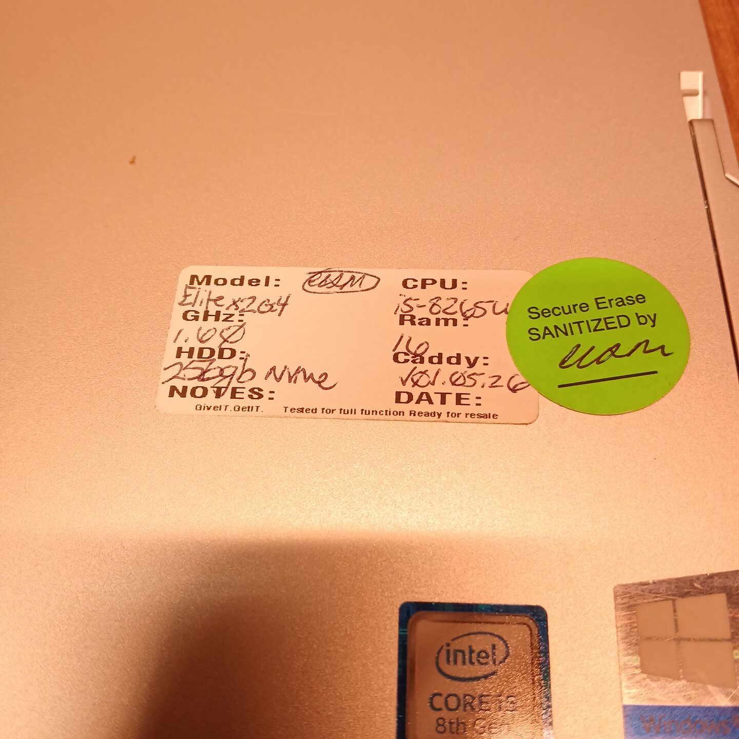 Close-up of HP Elite x2 G4 rear label showing Intel Core i5, 16GB RAM, and 256GB NVMe SSD details