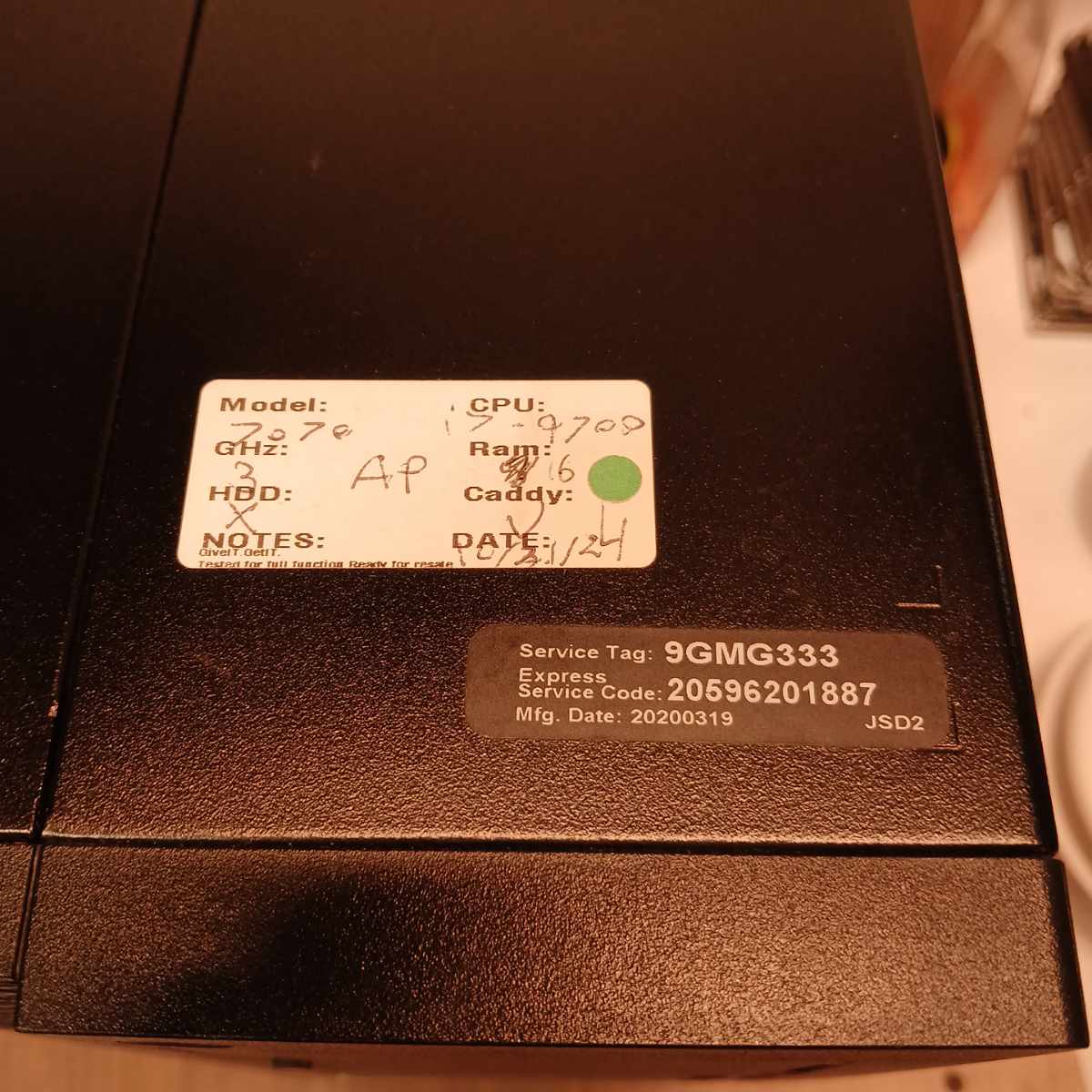 Dell OptiPlex 7070 service tag and asset label close-up on front panel