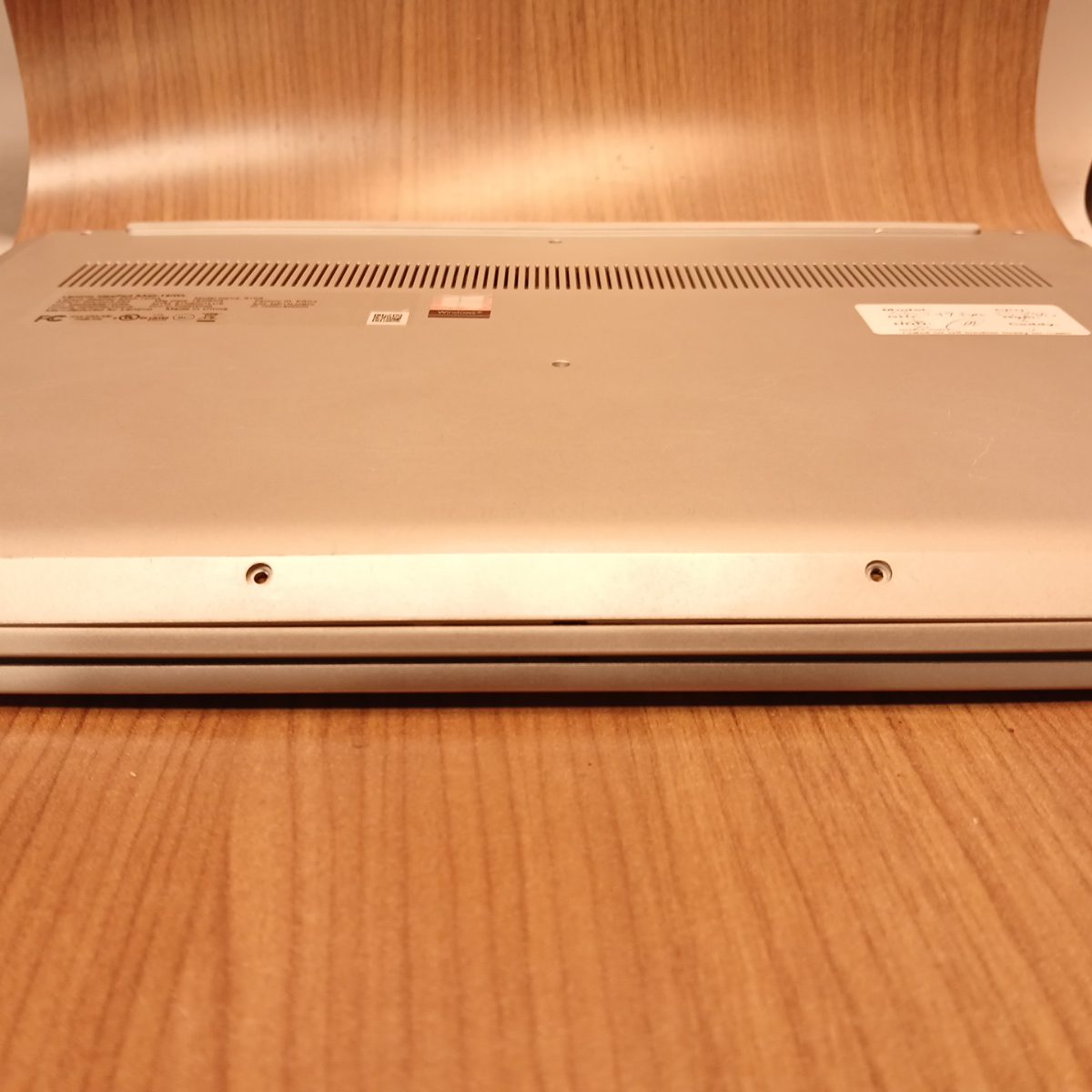 Underside of Lenovo IdeaPad S340-15IWL showing full bottom panel and screws