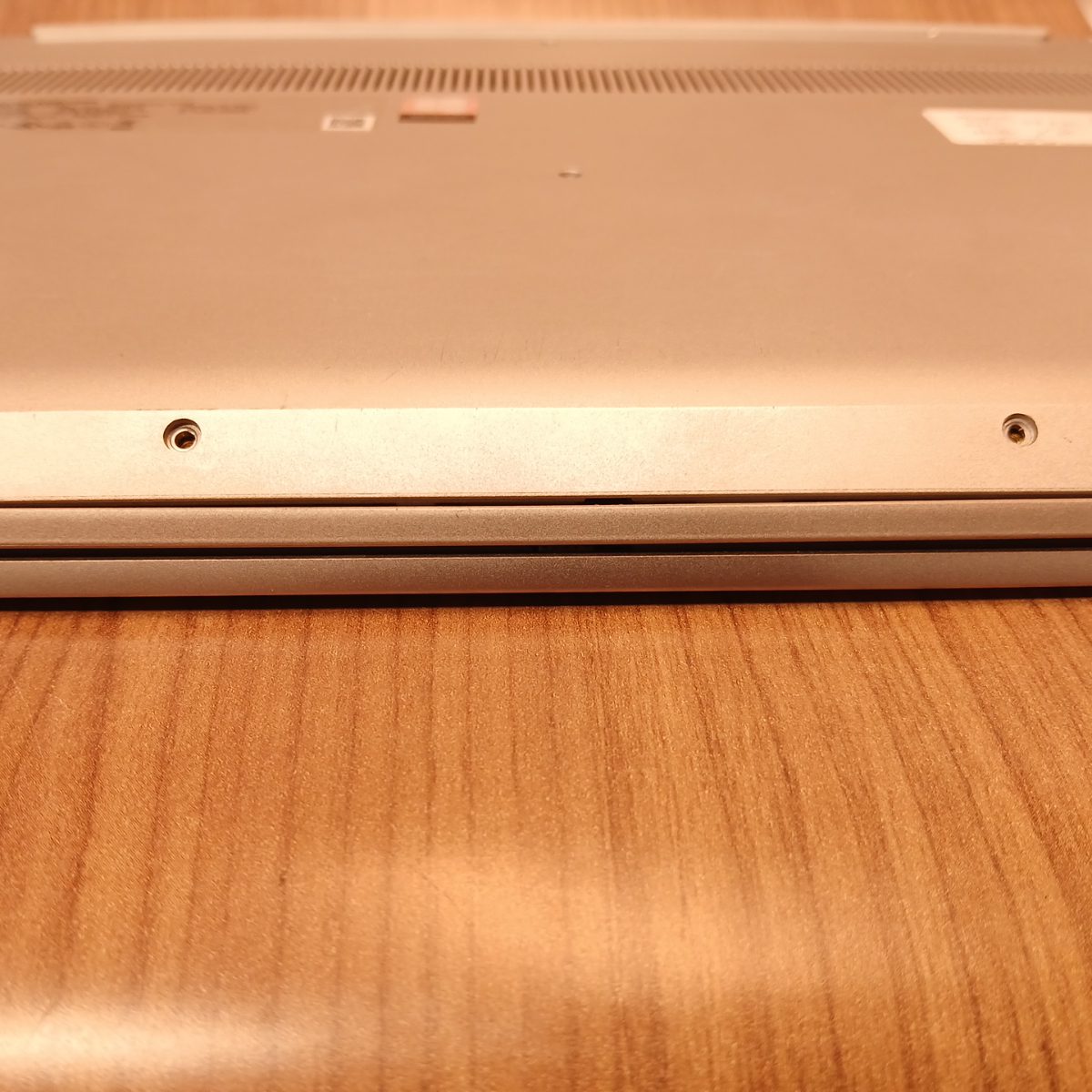 Rear underside edge of Lenovo IdeaPad S340-15IWL showing bottom panel condition