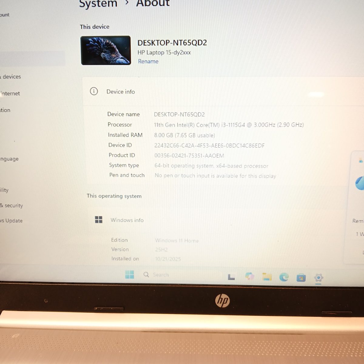 HP 15-dy2091wm laptop showing Windows 11 Home system information on the display