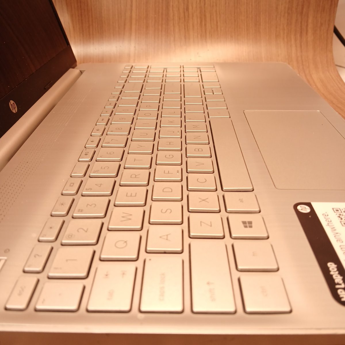 Angled keyboard and palmrest view of HP 15-dy2091wm silver laptop