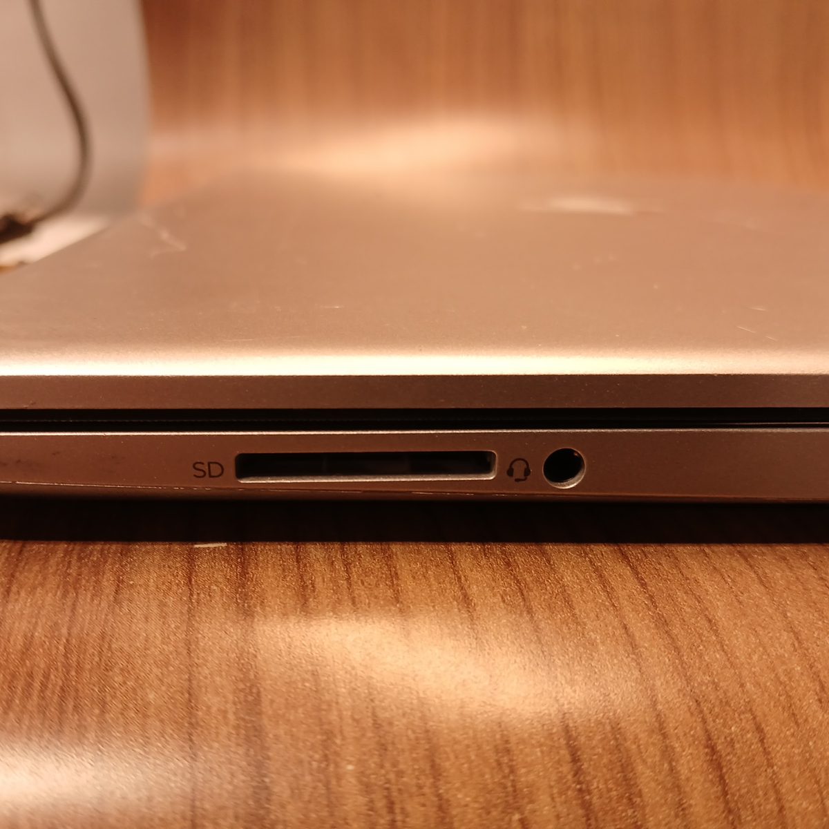 Front edge of HP 15-dy2091wm showing SD card reader and headphone jack