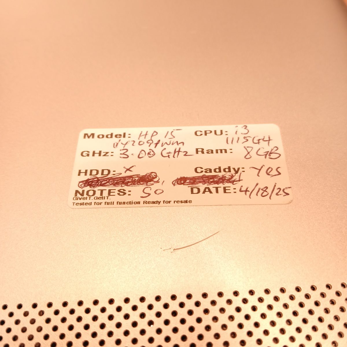 Bottom label on HP 15-dy2091wm showing handwritten CPU and RAM notes