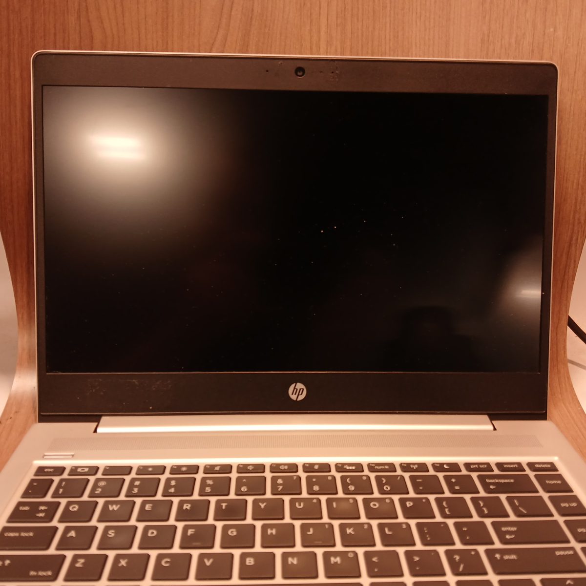 Front view of HP ProBook 440 G6 laptop with screen off and keyboard visible