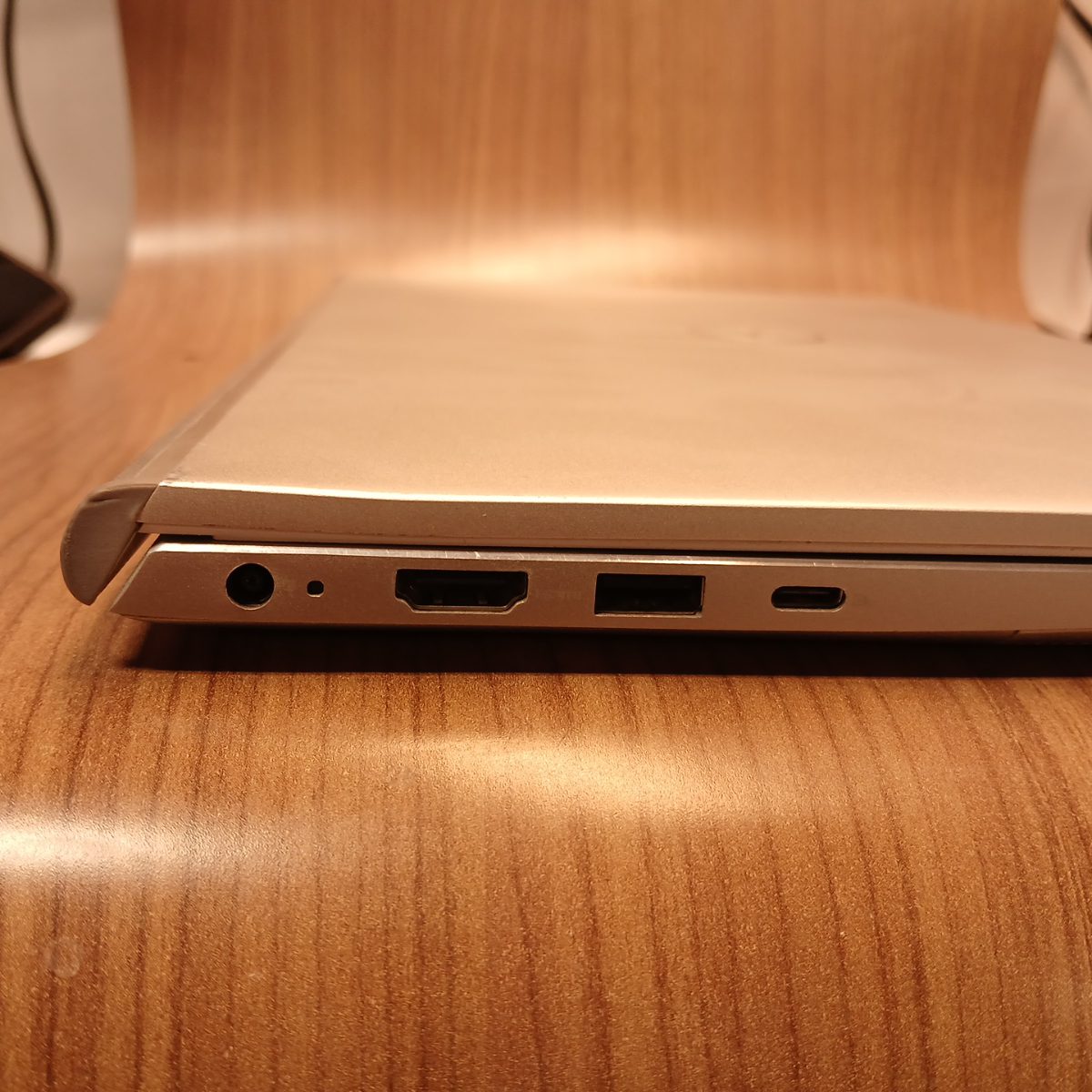 Left side ports on Dell Inspiron 15 7501 showing headset jack, HDMI, USB-A, and USB-C