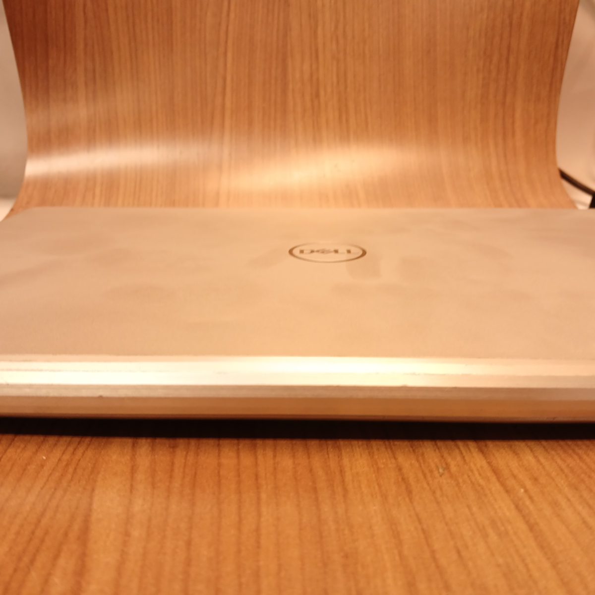 Closed lid view of Dell Inspiron 15 7501 silver laptop with Dell logo