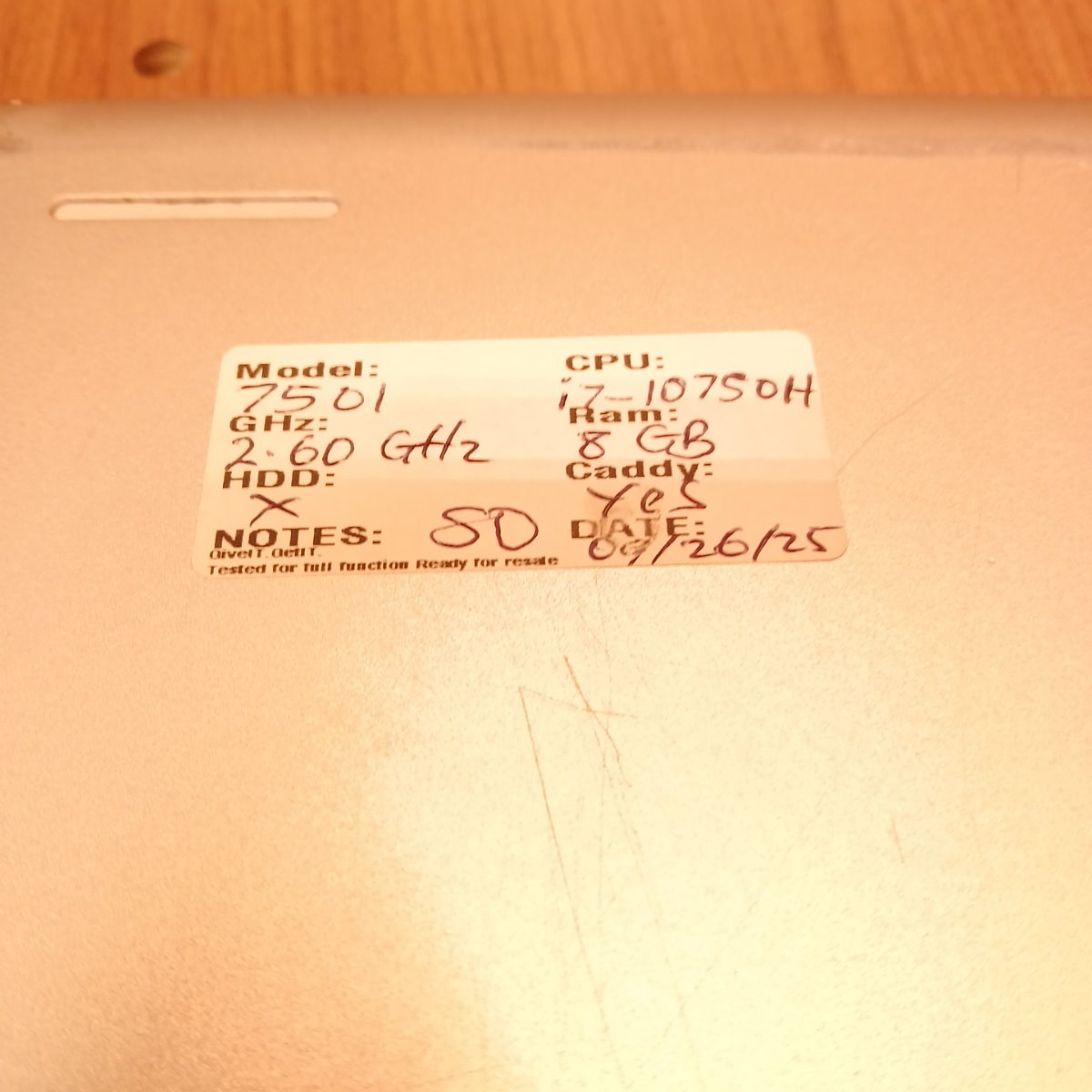 Bottom label on Dell Inspiron 15 7501 showing handwritten model and CPU details