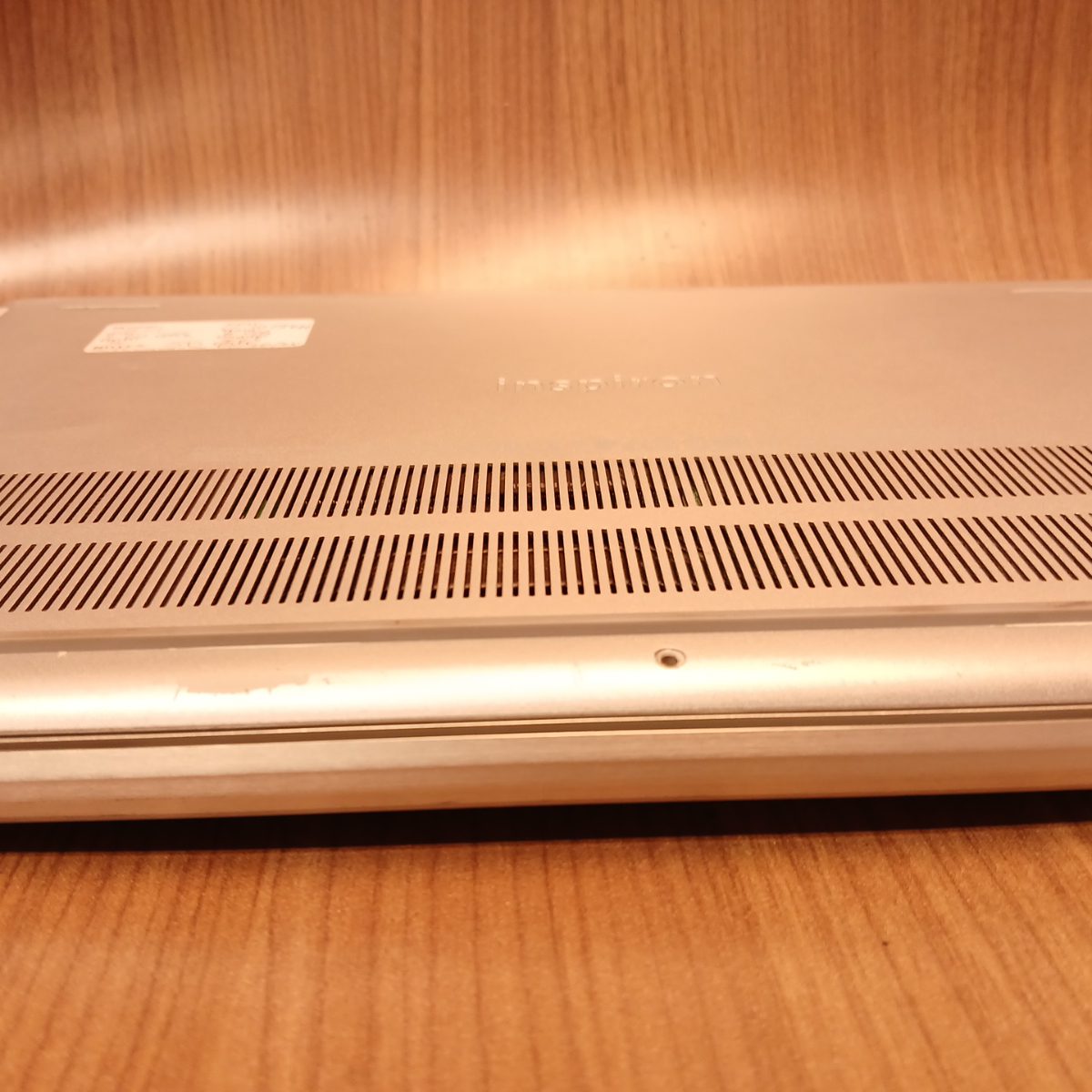 Bottom cover of Dell Inspiron 15 7501 showing rear ventilation grille